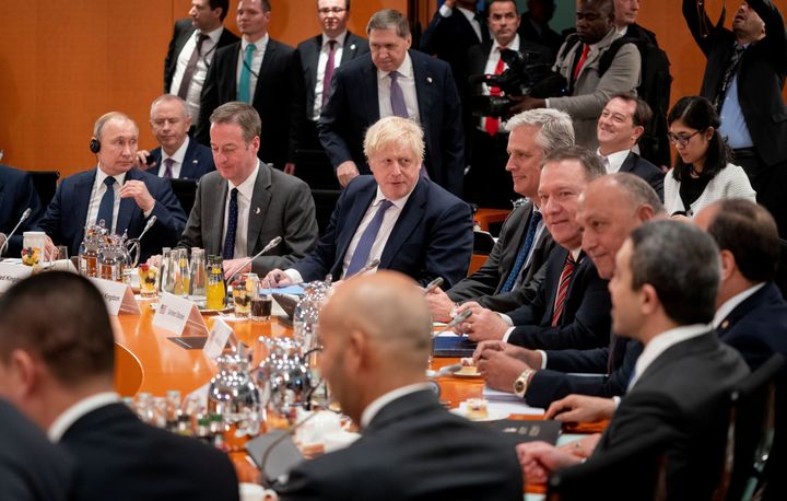 Boris Johnson pictures at the world leaders' summit in Berlin alongside Vladamir Putin and Mike Pompeo.