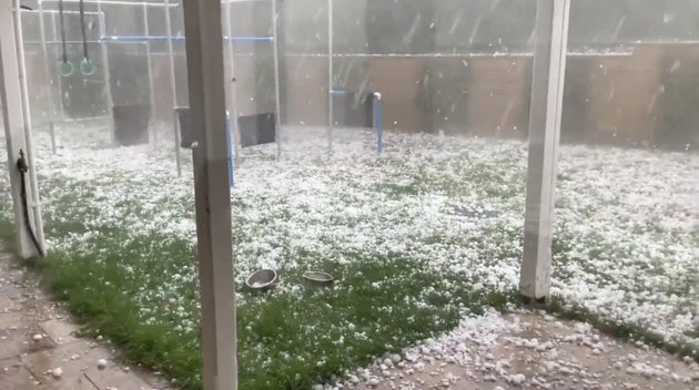 Hail stones hit the yard of a house in Warrandyte, Victoria, Australia January 19, 2020 in this picture grab obtained from a social media video.