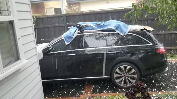 Hail stones fall on a car in Ashburton, Victoria, Australia January 19, 2020 in this picture grab obtained from a social media video. 