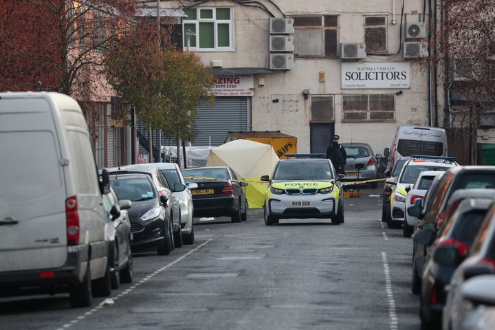 An evidence tent at the junction of Salisbury Road and Elmstead Road in Seven Kings, Ilford, east London, where three people died after being stabbed Sunday evening.