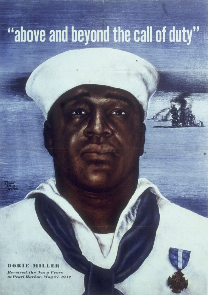 Circa 1942: Headshot portrait of Naval Mess Attendant 3rd Class Doris Miller, wearing a Navy Cross pinned to his sailor's uniform, under the headline, "above and beyond the call of duty," in an Office of War Information poster, World War II.