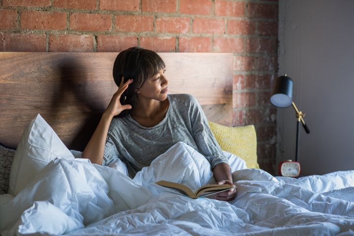 Giving yourself an extra hour in the morning grants the freedom to do whatever you want — like relax in bed.
