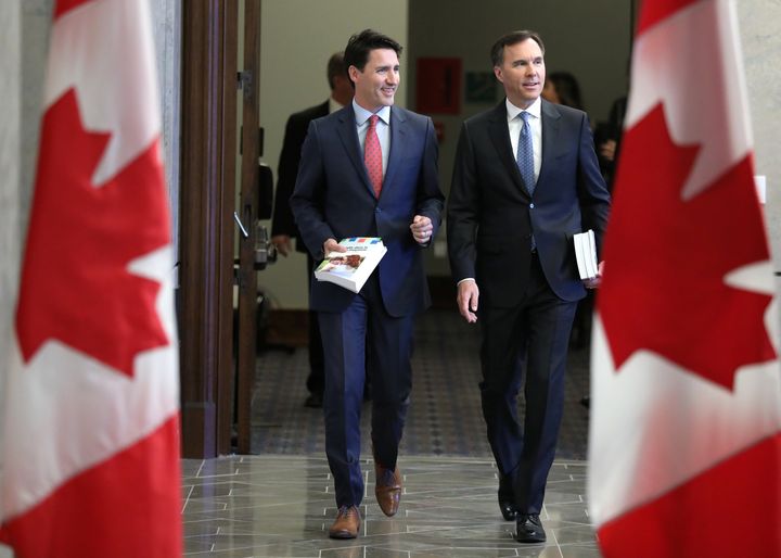 Prime Minister Justin Trudeau and Finance Minister Bill Morneau walk from Trudeau's office to the House of Commons to deliver the budget on Parliament Hill in Ottawa on March 19, 2019.