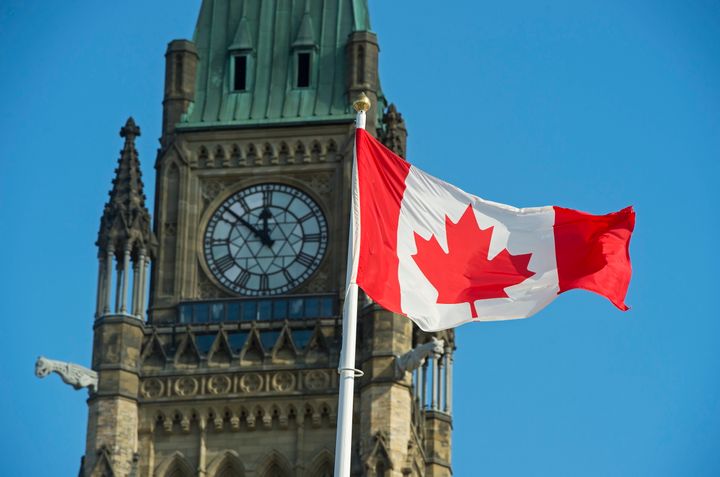 A Canadian flag flies near the Peace Tower on Parliament Hill in Ottawa on Oct. 23, 2019.