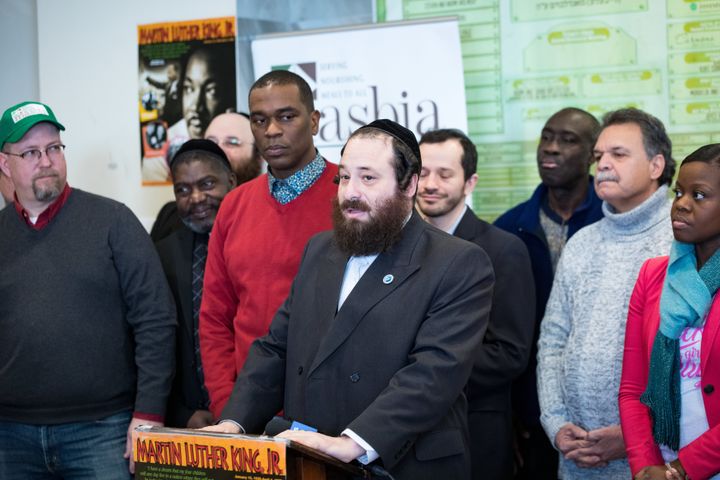 Rockland County legislator Aron Wieder, center, speaks at a Martin Luther King Day event in Brooklyn's Borough Park neighborhood. The event showcased Black-Jewish solidarity.