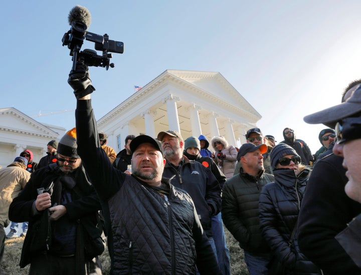 American radio host Alex Jones films the crowd inside the no-gun zone during a gun rights rally in front of the Virginia State Capitol building, in Richmond, Virginia, U.S. January 20, 2020. REUTERS/Jonathan Drake