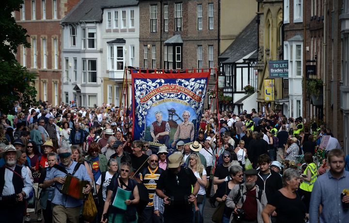 Former coal mining communities parade their banners through the centre of Durham during the Durham Miners Gala in July 2017