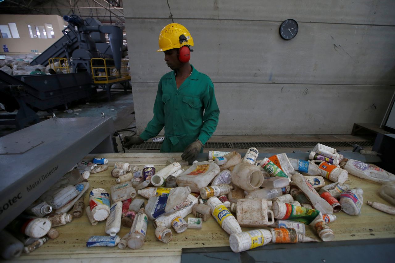 An employee sorts plastic waste before being processed at a plastic recycling factory in Nairobi, Kenya.