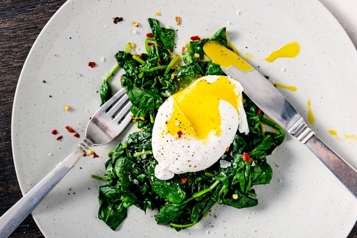 That bed of spinach will only release histamines and make a cold worse, but the egg can actually be good for a sore throat.