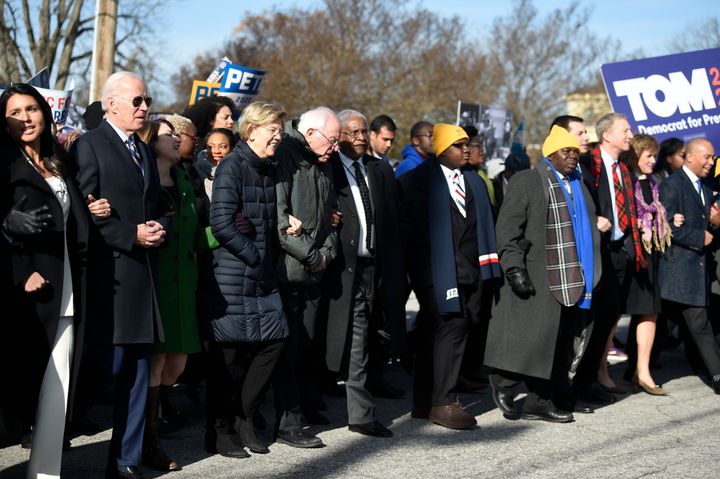 Most of the Democrats seeking their party's presidential nomination marched in a Martin Luther King Jr. Day rally on Monday in Columbia, South Carolina.