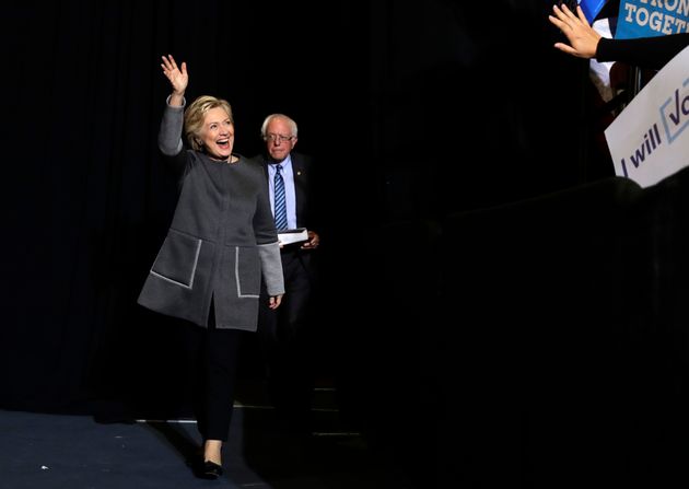 Democratic presidential candidate Hillary Clinton and Sen. Bernie Sanders, I-Vt. arrive for a panel discussion...