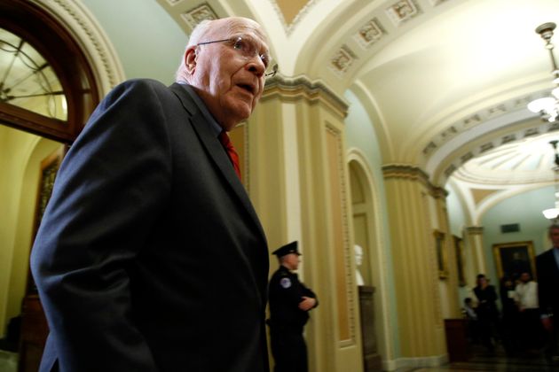 Sen. Patrick Leahy, D-Vt., talks with the media as he walks out of the Senate Chambers during a break in the impeachment trial of President Donald Trump at the Capitol Tuesday, Jan. 21, 2020, in Washington. (AP Photo/Steve Helber)