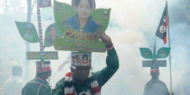 Indian supporters of Chief Minister of the southern Indian state of Tamil Nadu and the General Secretary of The All India Anna Dravida Munnetra Kazhagam (AIADMK) party, J.Jayalalithaa celebrate their party's victories in Tamil Nadu state, in Chennai on May 16, 2014. India's triumphant Hindu nationalists declared 'a new era' in the world's biggest democracy Friday after hardline leader Narendra Modi propelled them to the biggest win in 30 years on promises to revitalise the economy. AFP PHOTO