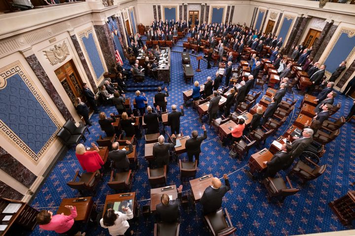 Still photographers are banned from the Senate chamber during the impeachment trial, but Senate Majority Leader Mitch McConnell and Senate Minority Leader Chuck Schumer released this official photo of the swearing-in.