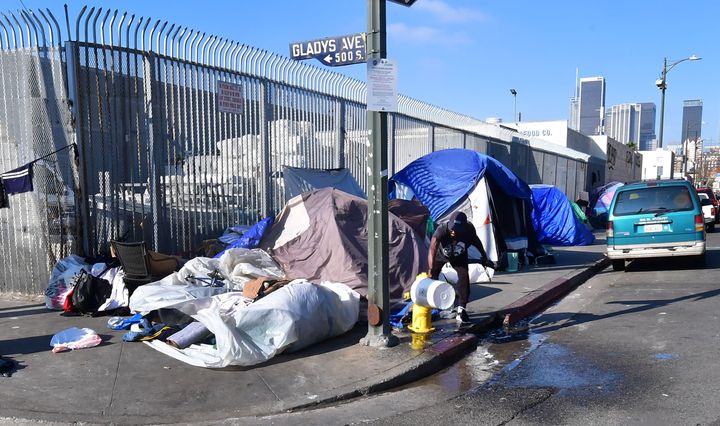 Tents where homeless residents sleep line a sidewalk near downtown Los Angeles on Jan. 8.