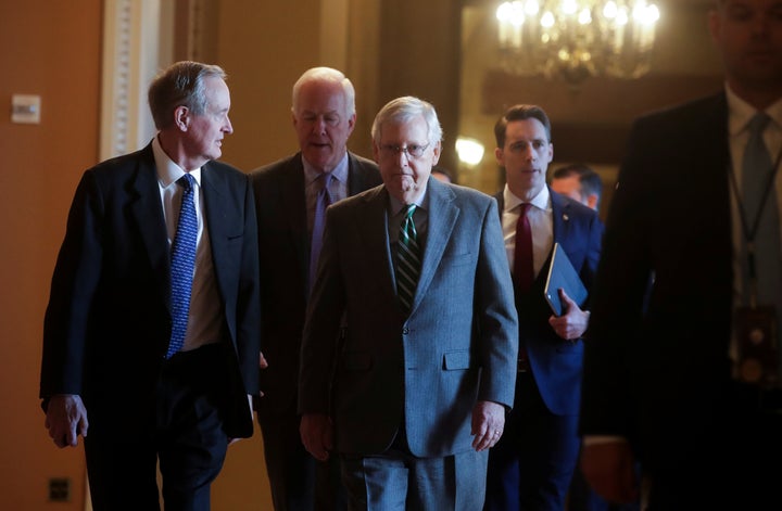 Senate Majority Leader Mitch McConnell and other Republican senators before the procedural start of the impeachment trial of