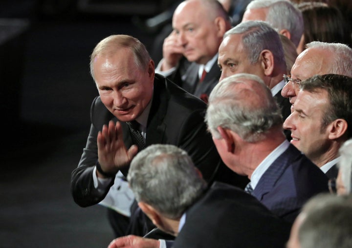 Russian President Vladimir Putin greets fellow world leaders attending the fifth World Holocaust Forum at the Yad Vashem Holocaust memorial museum in Jerusalem on January 23, 2020.