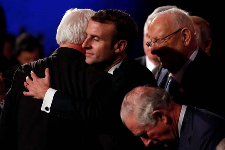 German President Frank-Walter Steinmeier and French President Emmanuel Macron hug at the World Holocaust Forum in Jerusalem, January 23, 2020. 