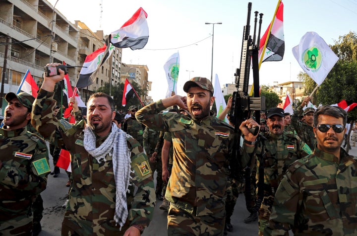 Iraqi Shiites from the Badr forces militia protest against the military intervention in Yemen, in Baghdad, Iraq in 2015. (Pho