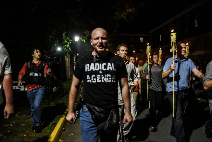 Christopher Cantwell and other white nationalists participate in a torch-lit march on the grounds of the University of Virginia on Aug. 11, 2017, ahead of the Unite the Right rally in Charlottesville, Virginia.