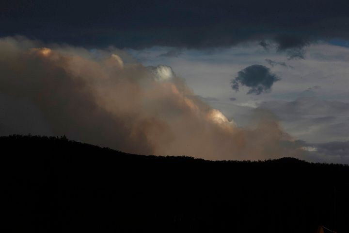Smoke is seen from the Good Good fire on January 23, 2020 in Cooma, Australia. on January 23, 2020 in Cooma, Australia. Three American firefighters have have died after their C-130 water tanker plane crashed while battling a bushfire near Cooma in southern NSW on Thursday. (Photo by Jenny Evans/Getty Images)