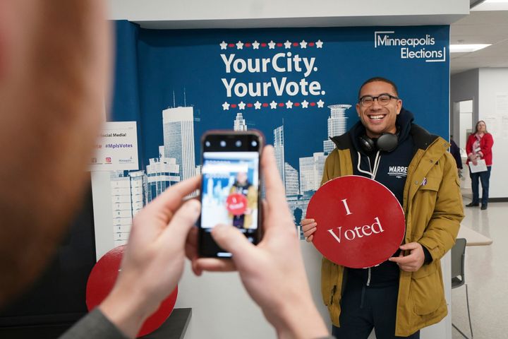 Jared Mollenkof has his photo taken after voting at the Minneapolis Early Voting Center, on Jan. 17, 2020.