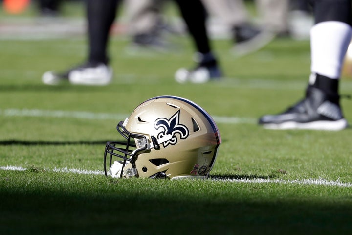 FILE - In this Oct. 23, 2016, file photo, a New Orleans Saints helmet rests on the playing field before an NFL football game in Kansas City, Mo. The Saints are going to court to keep the public from seeing hundreds of emails that allegedly show team executives doing public relations damage control for the area's Roman Catholic archdiocese to help it contain the fallout from a burgeoning sexual abuse crisis. (AP Photo/Jeff Roberson, File)