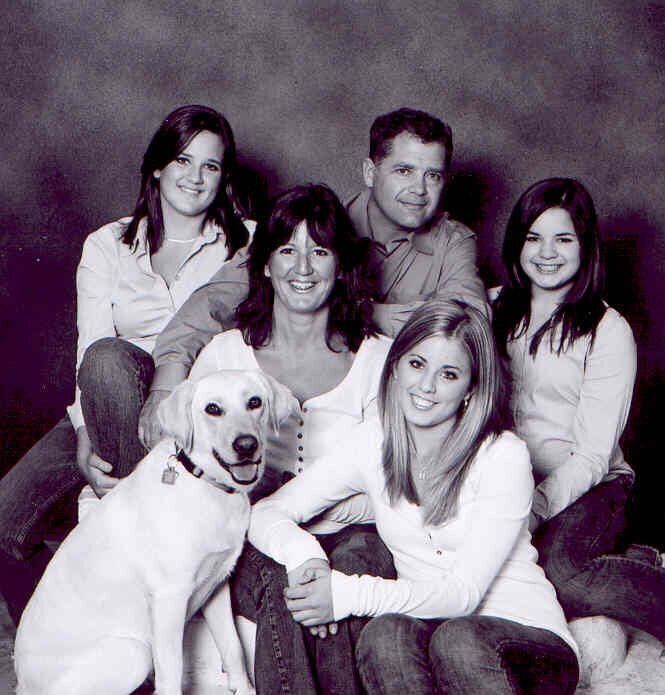 Conservative MP Len Webber, in the back, is shown in an undated photo with his late wife, Heather, their daughters (from left to right) Lauren, Jaime and Kelly, and the family dog, Lucy.