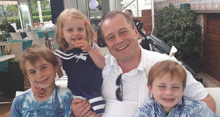 Undated family handout photo issued by Garda of Conor McGinley, 9, Darragh McGinley, 7, and Carla McGinley, 3, with their father Andrew McGinley. 
