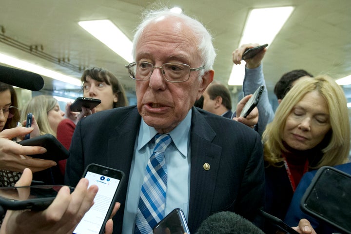 Sen. Bernie Sanders, I-Vt., talks to reporters as he arrives at the Senate for the start of the impeachment trial of President Donald Trump on Jan. 21, 2020.