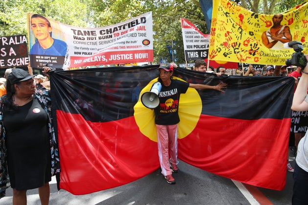 People march down Elizabeth St during the Invasion Day march on January 26, 2020 in Sydney,