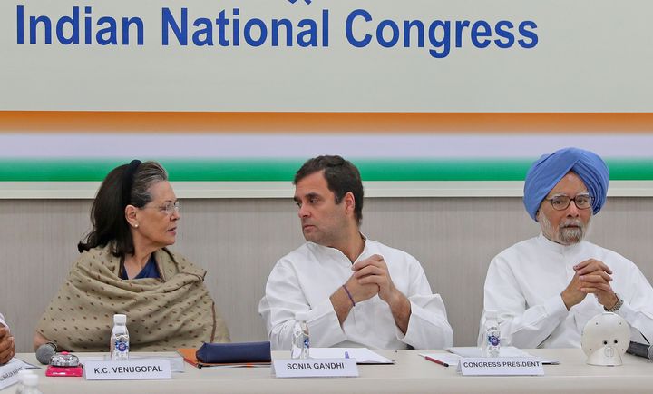 A file photo of Congress President Sonia Gandhi, former party President Rahul Gandhi, center, and former Indian Prime Minister Manmohan Singh 