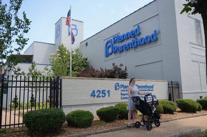 ST LOUIS, MO - JUNE 04: A women stands with her child in a stroller during a pro-life rally outside the Planned Parenthood Reproductive Health Center on June 4, 2019 in St Louis, Missouri. The fate of Missouri's lone abortion clinic could be decided today in St. Louis Circuit Court after a restraining order prohibiting Missouri from letting the clinic's license lapse was granted last week. (Photo by Michael B. Thomas/Getty Images)