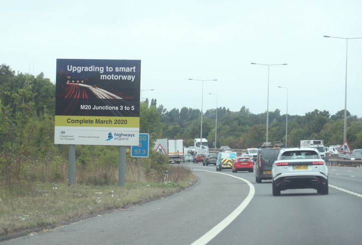 A sign announcing a section of the M20 being upgraded to smart motorway, in Kent.