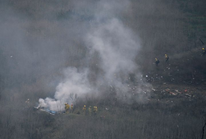 <strong>LA county firefighters on the scene of the helicopter crash in Calabasas, California.</strong>