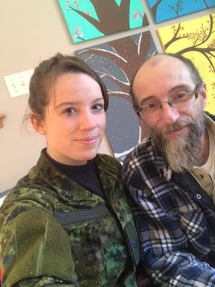 Tiffany Mackey poses with her father while helping out in Newfoundland.