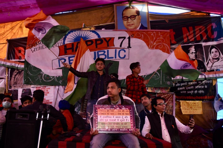 Anti-CAA protesters wave Indian flags as they celebrate the 71st Republic Day at Shaheen Bagh.