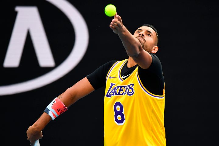 Nick Kyrgios, pictured serving during warmups, was one of many athletes to honor Bryant following his death.