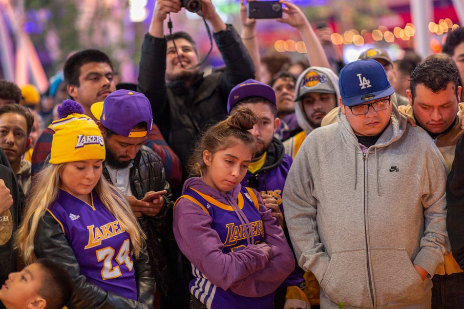 Fans seen paying homage to Kobe Bryant in Los Angeles on Jan. 26. 