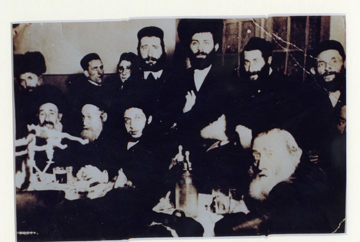 The only surviving photo of Pinchas Gutter's many extended family members at a cousin's wedding in 1938. All but two of these men perished in the Holocaust.