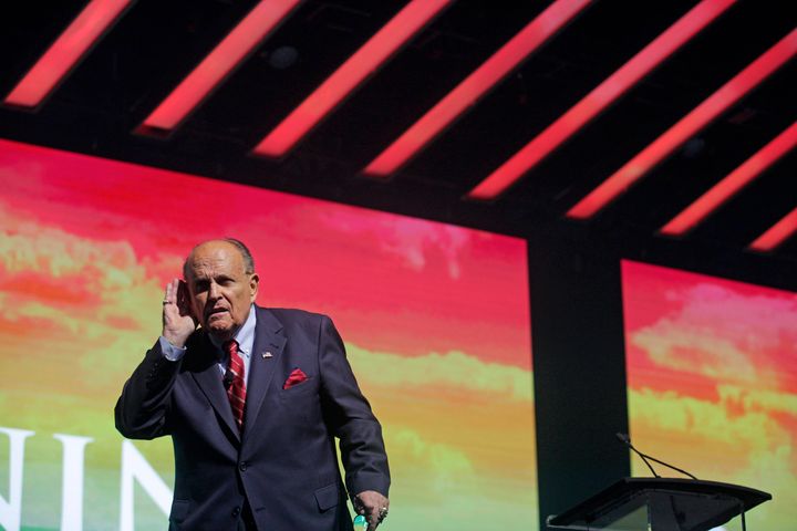 Rudy Giuliani, President Trump's personal attorney, addresses the conservative Turning Point USA Student Action Summit on Dec. 19 in Palm Beach, Florida. A member of Trump's defense team referred to Giuliani on Monday as the Democrats' "colorful distraction."