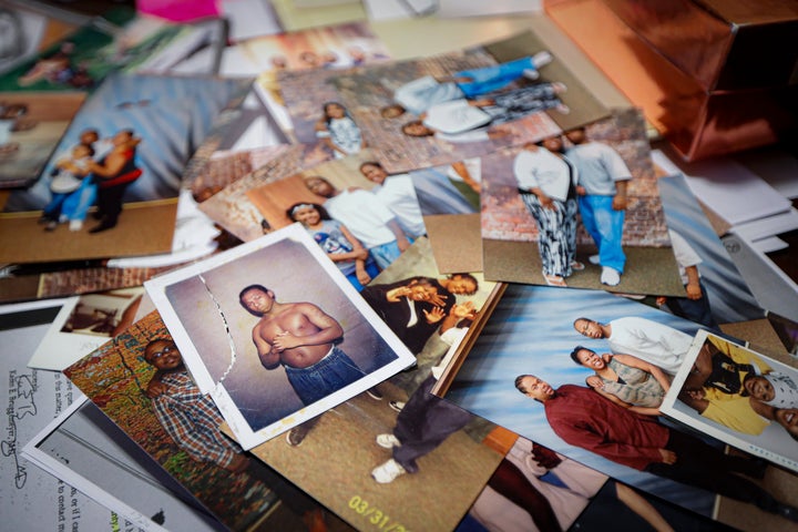 Family photos of Myon Burrell during his teenage years before and after incarceration are displayed a the home of his sister, Ianna, in Shakopee, Minn., Friday, Oct. 25, 2019. (AP Photo/John Minchillo)