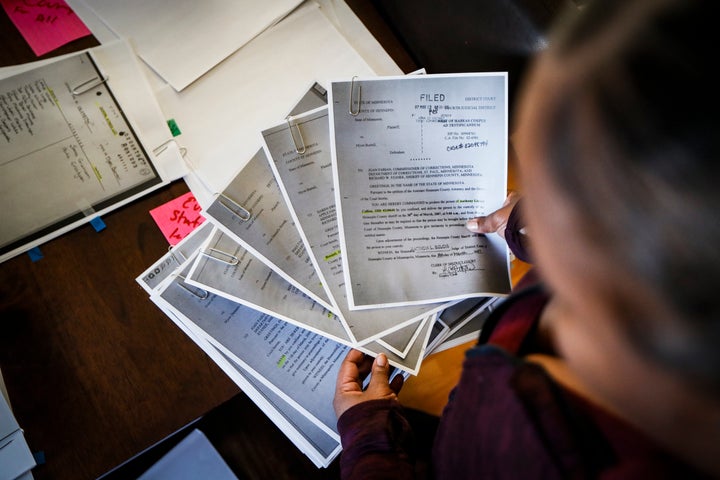 Ianna Burrell pours over documents and photographs of her incarcerated brother Myon Burrell at her home, Friday, Oct. 25, 2019, in Shakopee, Minn. (AP Photo/John Minchillo)