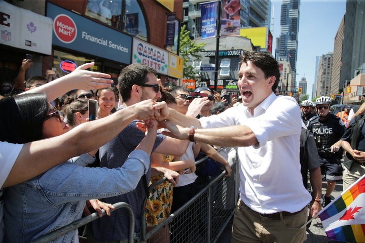 Prime Minister Justin Trudeau greets people as he joins supporters of Toronto's LGBTQ community as they march in one of North America's largest Pride parades, in Toronto on June 23, 2019.