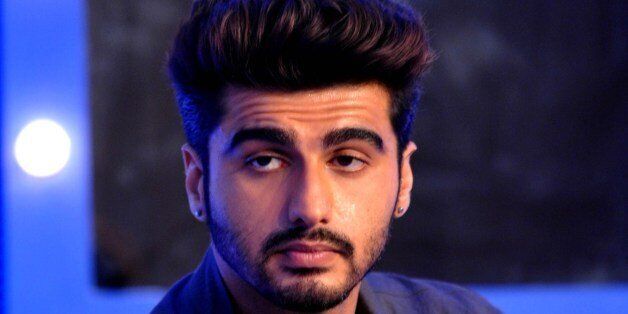 Indian Bollywood actor Arjun Kapoor poses for a photograph during a promotional event in Mumbai on late July 7, 2014. AFP PHOTO / STR (Photo credit should read STRDEL/AFP/Getty Images)