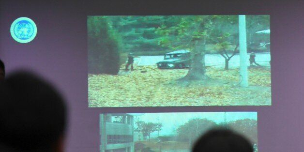A surveillance TV footage containing the moment of defection of a North Korean Soldier, is seen during a press briefing by the United Nations Command at the Defence Ministry in Seoul on November 22, 2017.A North Korean soldier crossed the border into the South in breach of a 1953 armistice agreement as he pursued a defector who was shot last week, the US-led United Nations Command (UNC) said on November 22. / AFP PHOTO / JUNG Yeon-Je (Photo credit should read JUNG YEON-JE/AFP/Getty Images)
