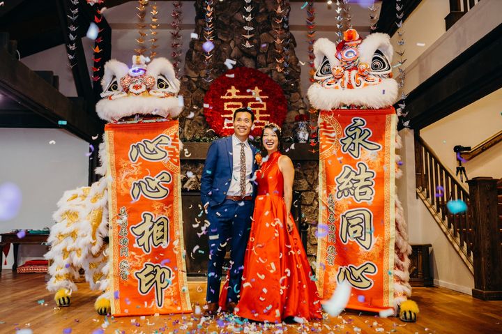 The author and her husband during the Chinese lion dance that was part of their wedding weekend.