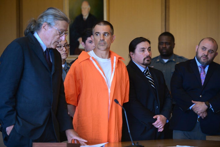 Fotis Dulos, center, listens, as his attorney Norm Pattis, left, addresses the court during a hearing at Stamford Superior Co