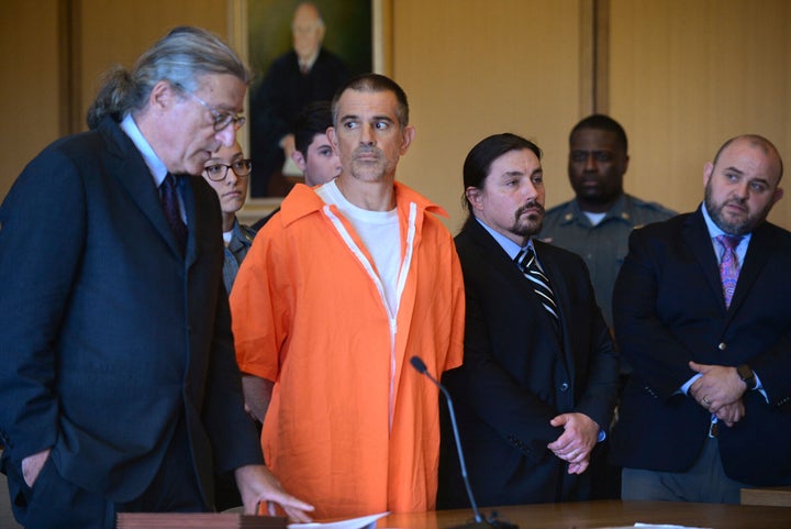 Fotis Dulos, center, listens, as his attorney Norm Pattis, left, addresses the court during a hearing at Stamford Superior Court, Tuesday, June 11, 2019 in Stamford, Conn. (Erik Trautmann/Hearst Connecticut Media via AP, Pool)