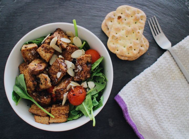 Tempeh, seen here atop a salad, can contain 16 grams of protein per 3-ounce serving.